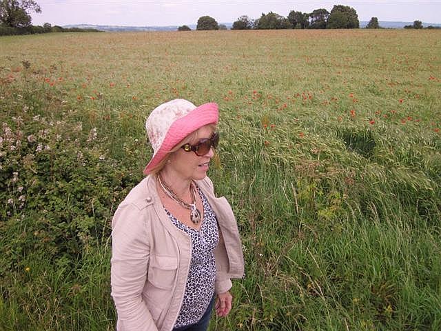 Gail Isaac in a poppy field high on a hill near Castle Cary, 2011 Photo by Peter Isaac