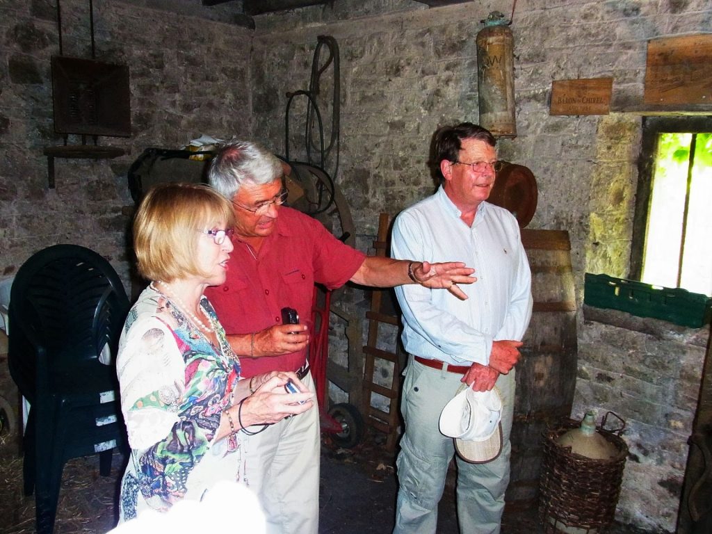Gail Isaac, Edward Lutley and Peter Isaac in Nobby Kerton's cider press